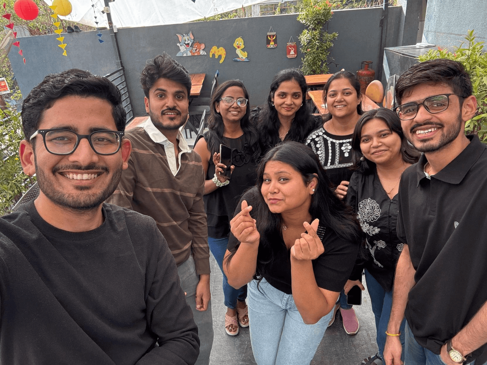 VSquare team members smiling for a group selfie